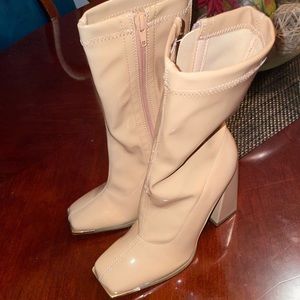 Tan heeled boots. Never worn.